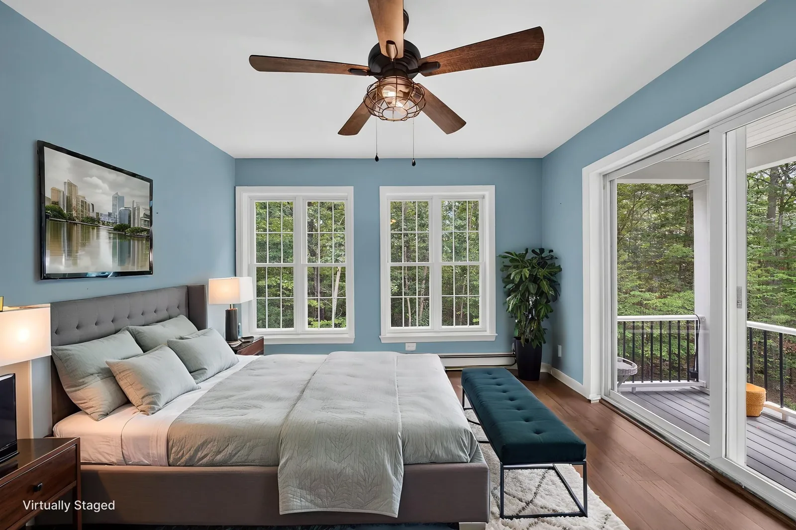 Primary bedroom with French doors in an Alton, NH home