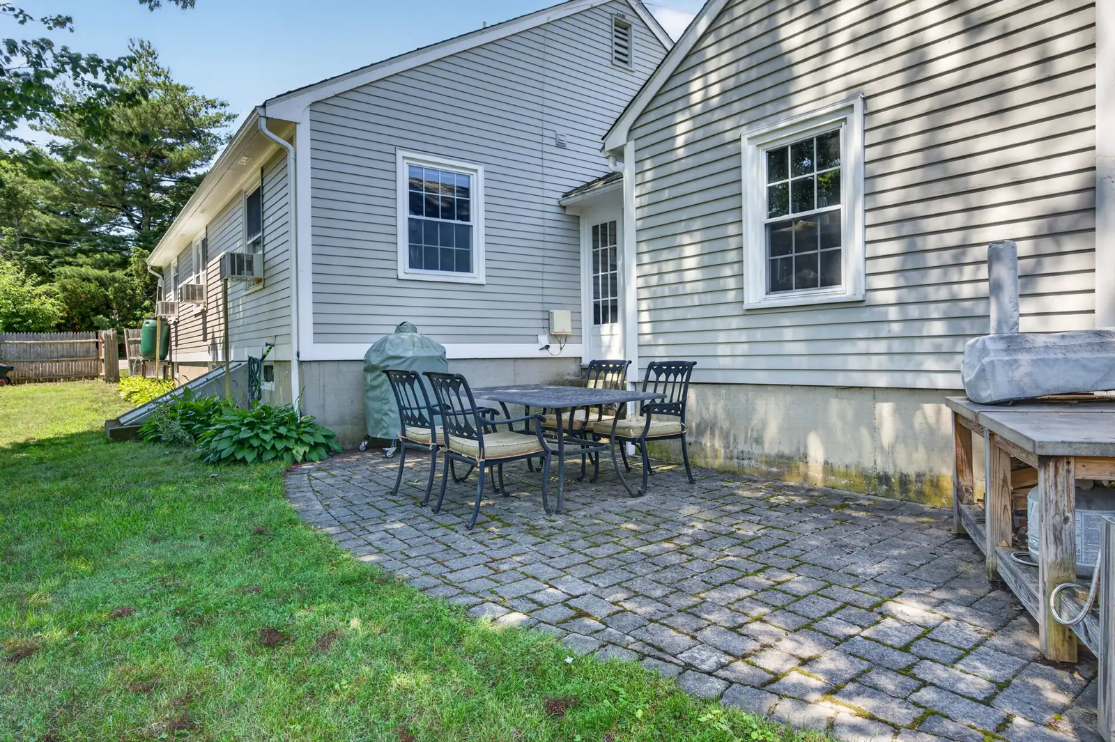 Backyard and rear exterior of a home on Lowell St in Andover, MA
