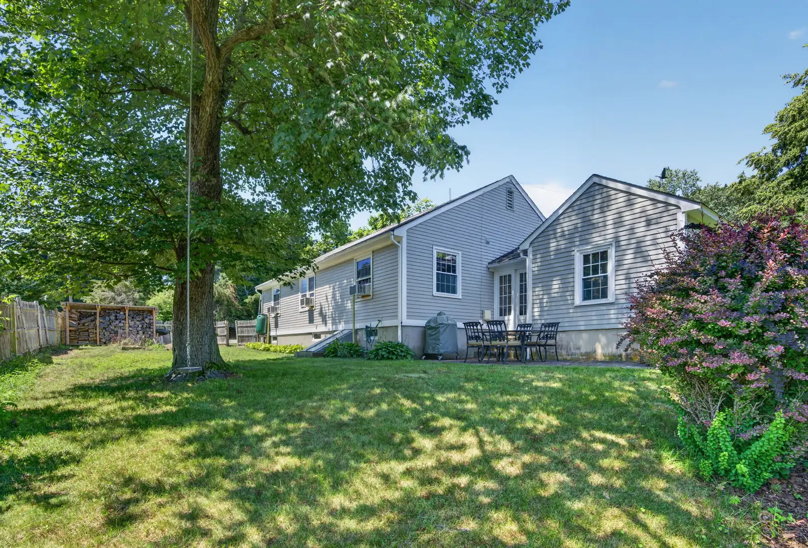 Front exterior and lawn of a single-family home on Lowell St in Andover, MA