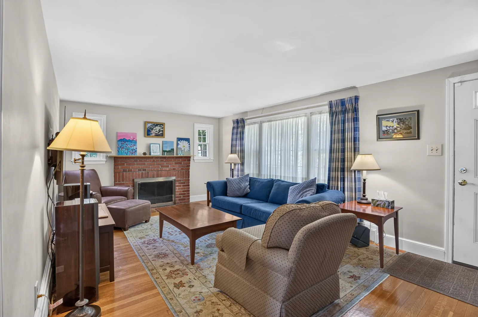 Living room with fireplace in a home on Lowell St in Andover, MA