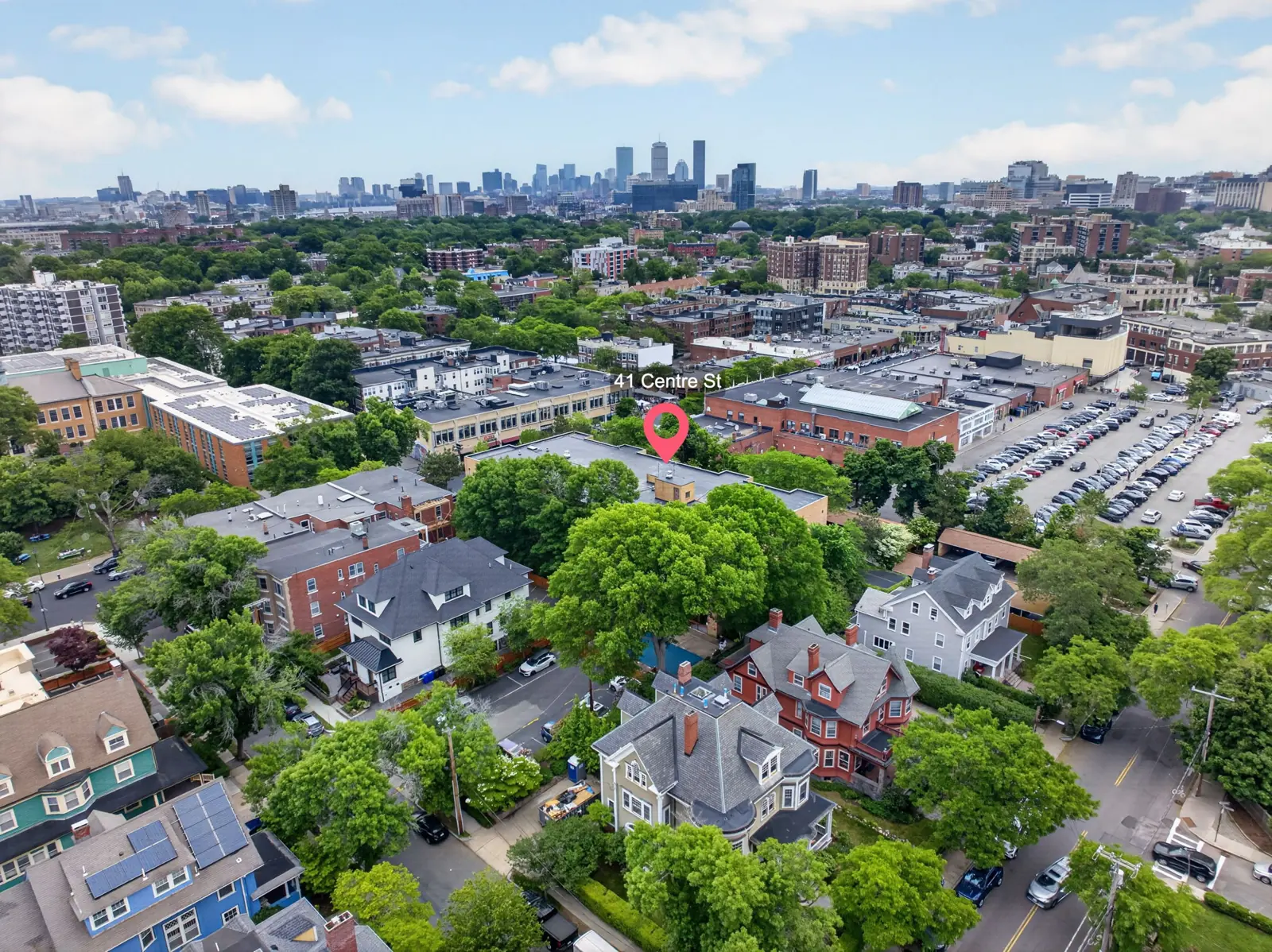 Aerial drone view of Brookline, MA toward the Boston skyline