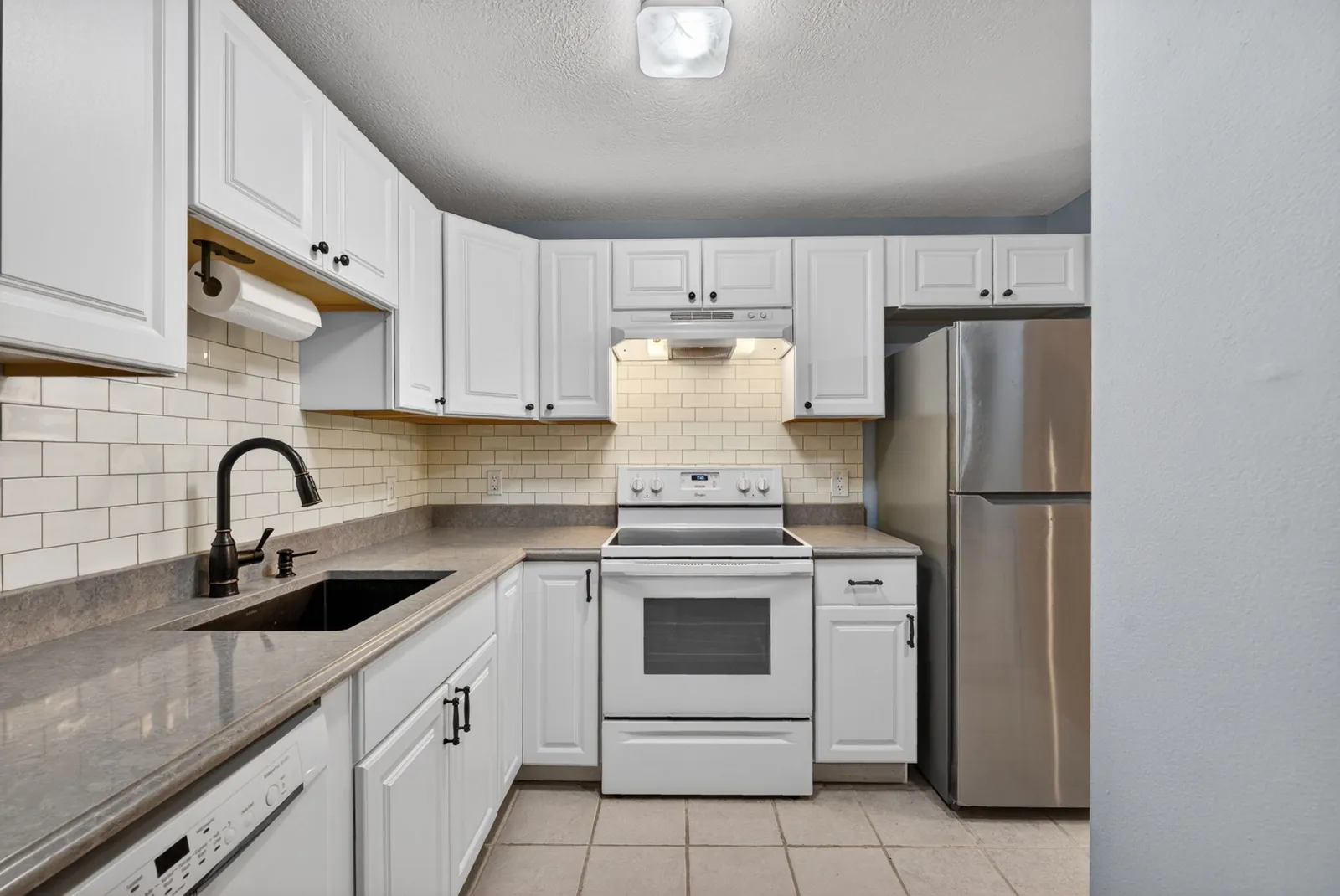 Bright white condo kitchen in Goffstown, NH