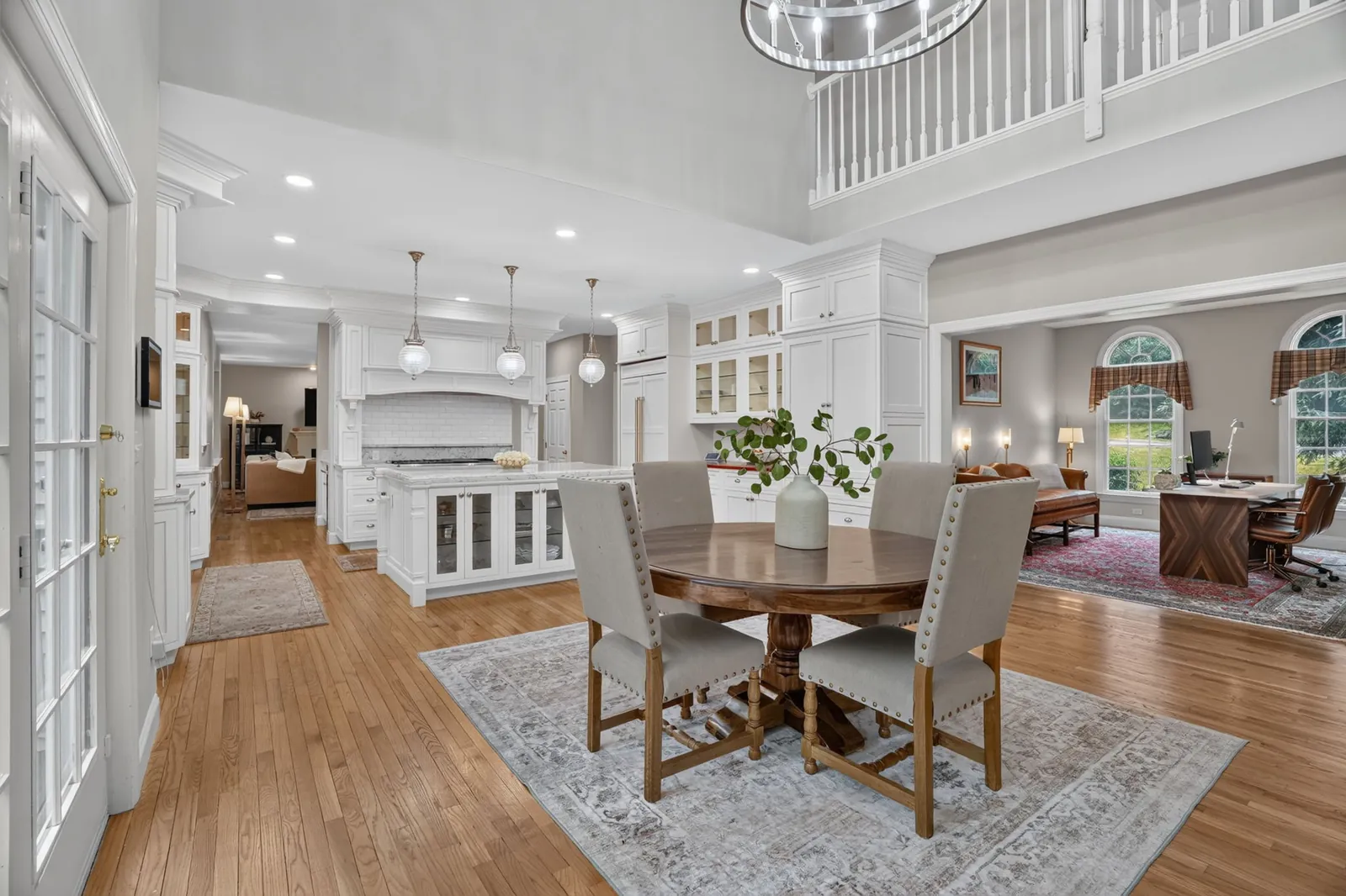Open dining area flowing into the kitchen and family room of a Hopkinton, MA home