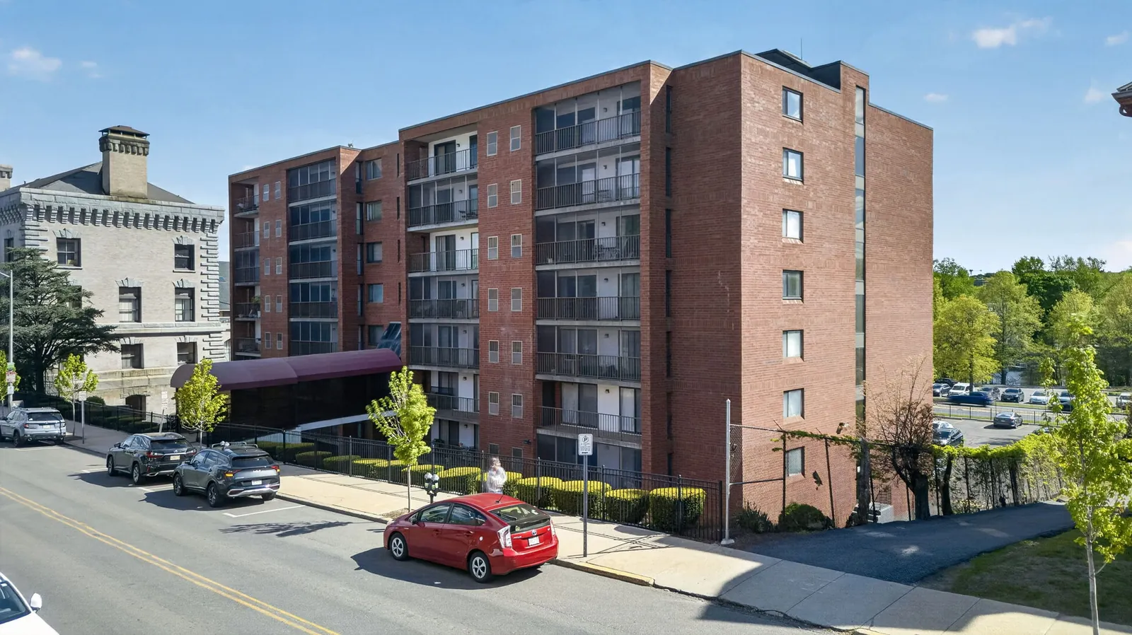 Exterior of a brick condominium building on High St in Medford, MA