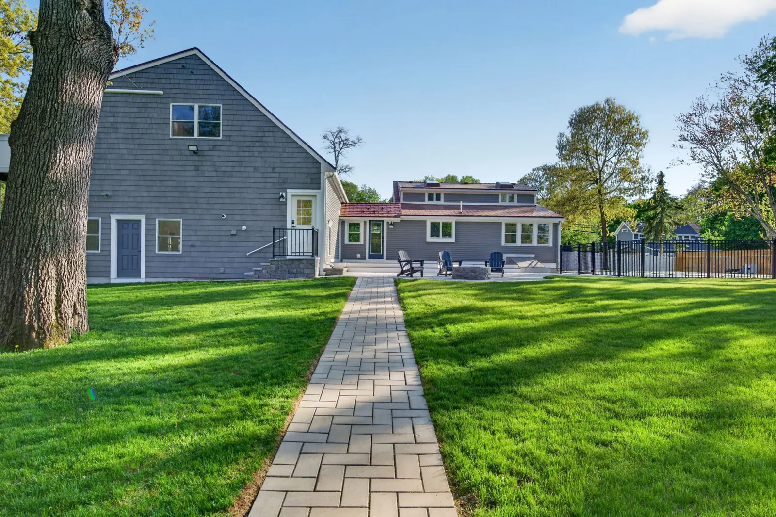Backyard lawn and stone walkway at a home on Merrimac St in Newburyport, MA