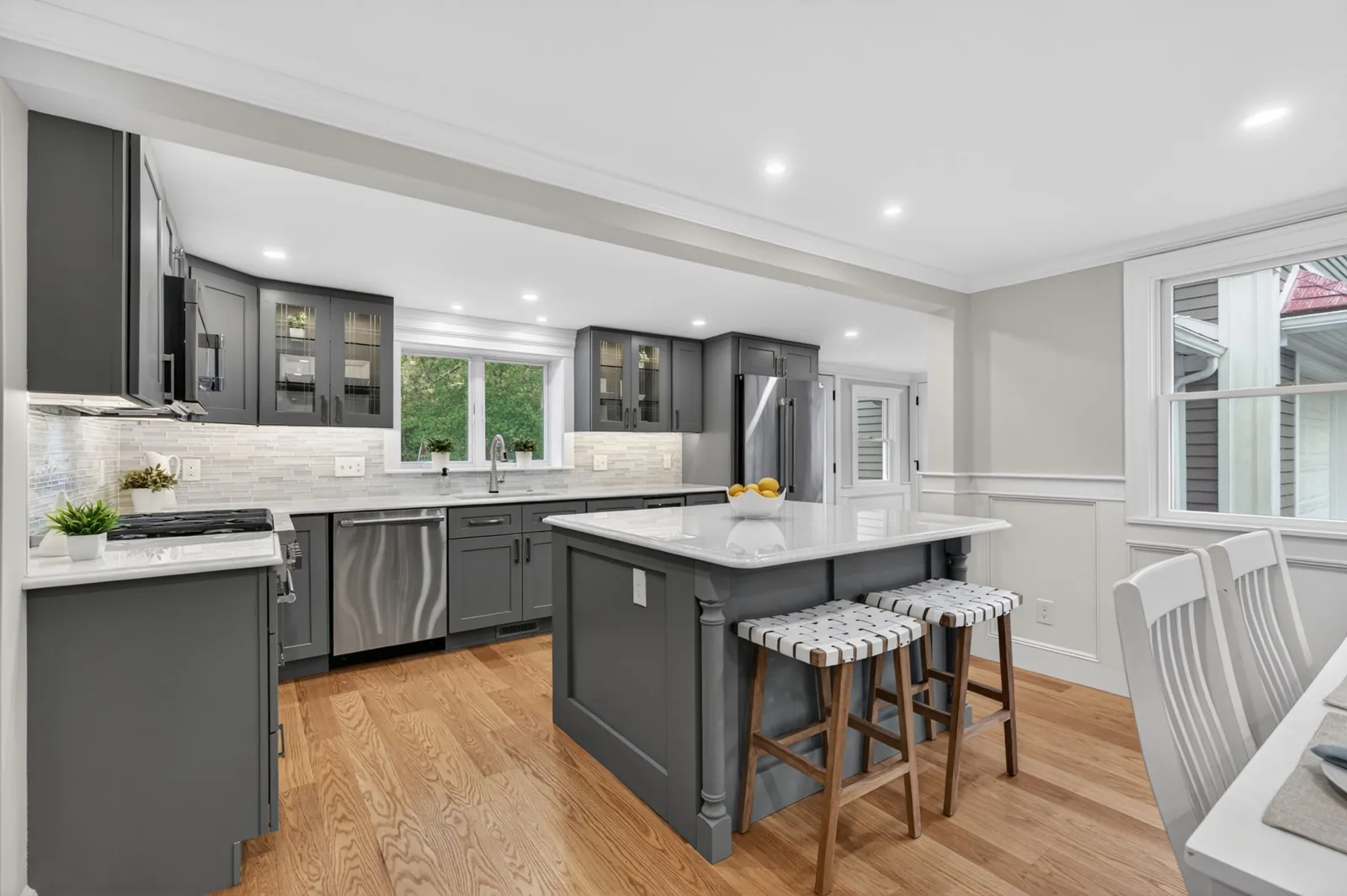 Renovated kitchen with gray cabinets and island in a Newburyport, MA home