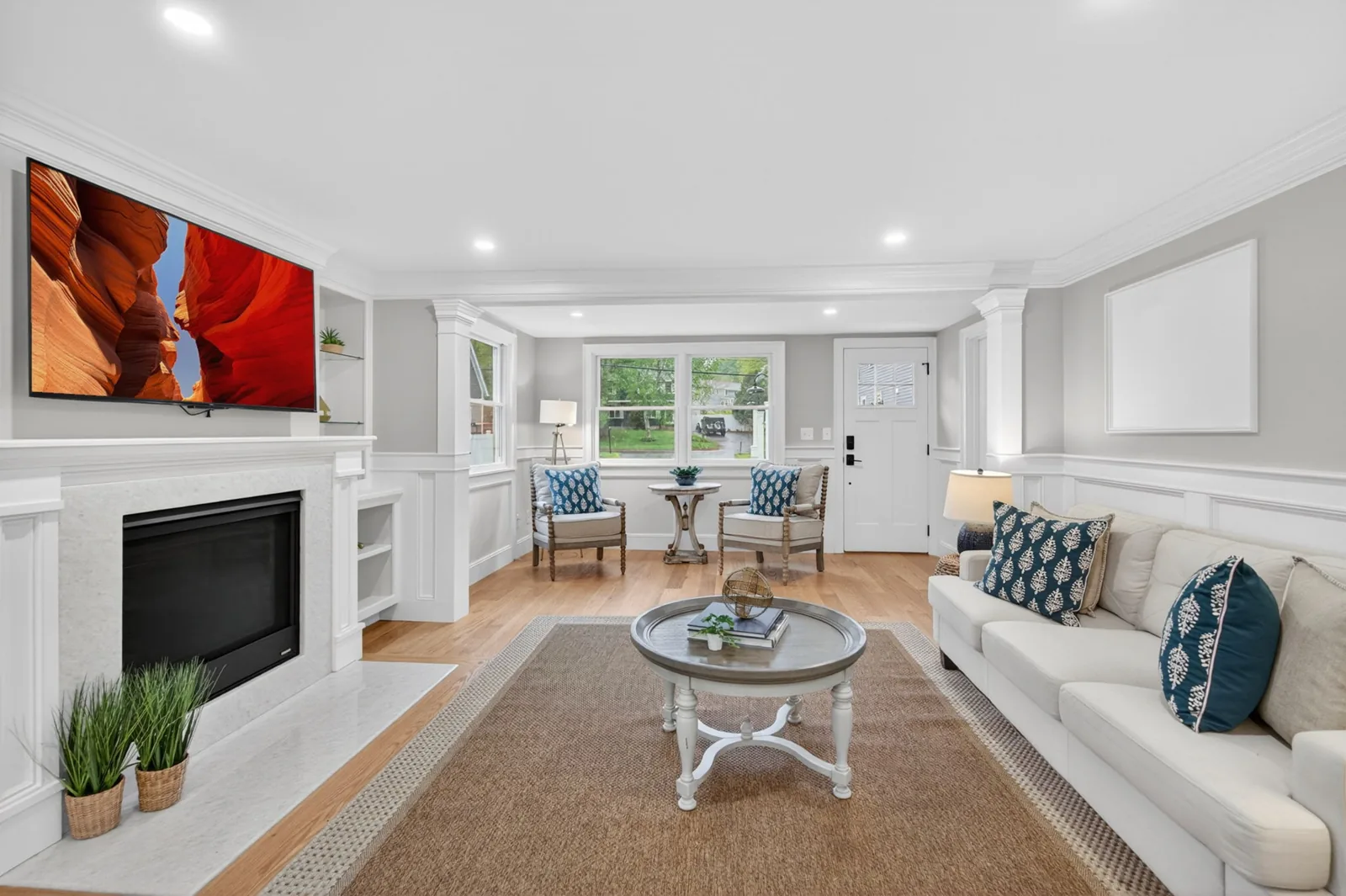 Living room with fireplace and built-ins in a home on Merrimac St in Newburyport, MA