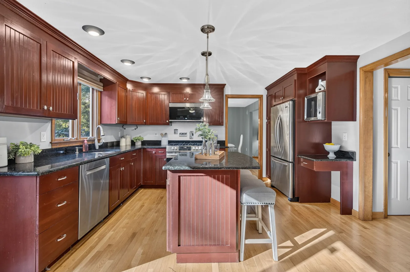 Kitchen with island and granite counters in a North Reading, MA home