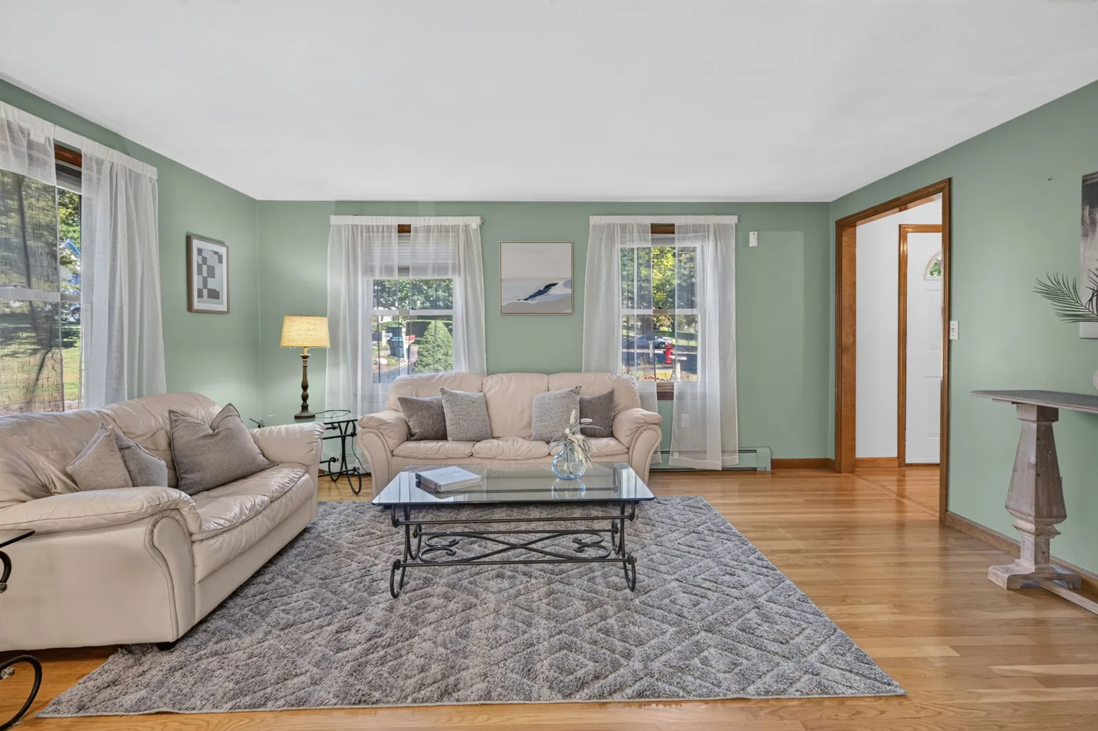 Bright living room with hardwood floors in a North Reading, MA home