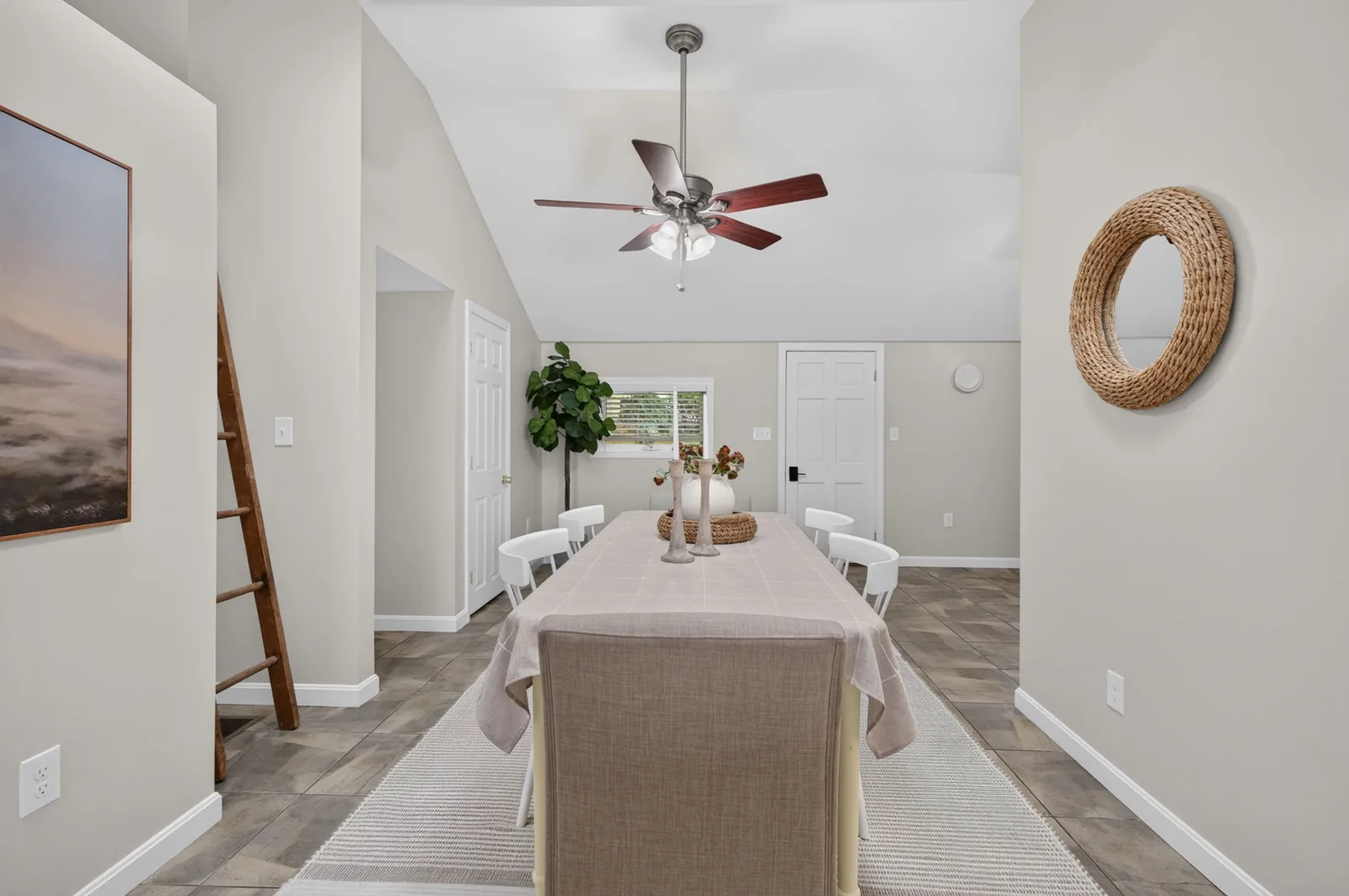 Dining area with vaulted ceiling in a home on Lakeside Dr in Sandown, NH