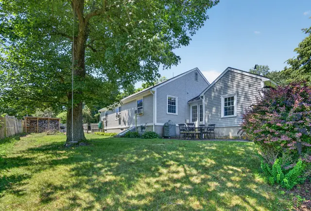 Front exterior and lawn of a single-family home on Lowell St in Andover, MA