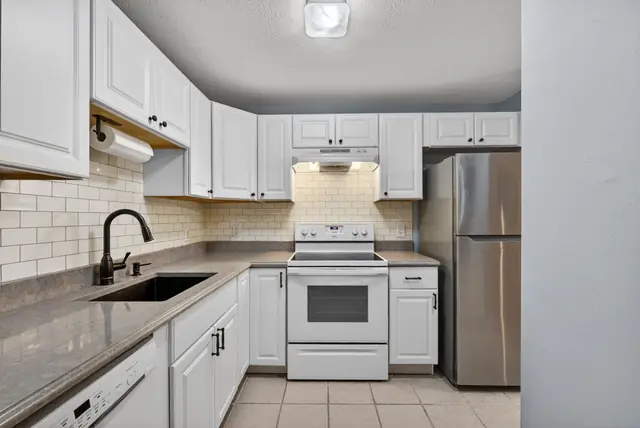 Bright white condo kitchen in Goffstown, NH