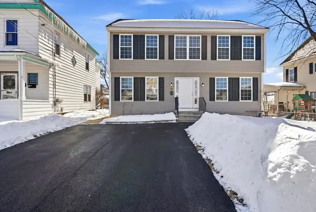 Exterior of a two-story Colonial on King St in Nashua, NH