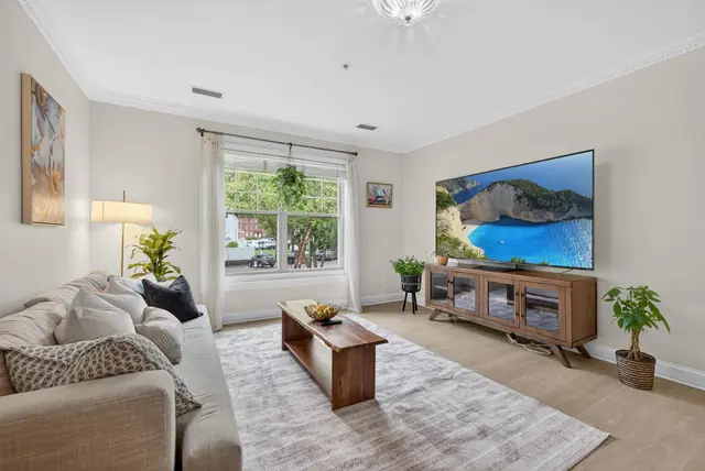 Condo living room with large windows in Wakefield, MA